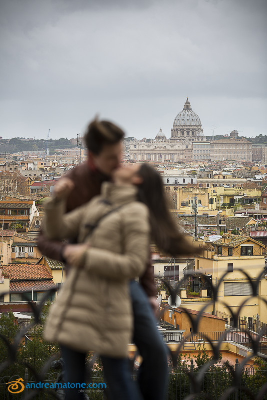 Kissing while overlooking the city from above. Out of focus version of the picture.