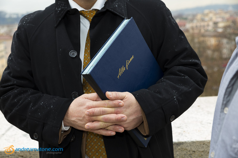 The Wedding Celebrant holding the Book