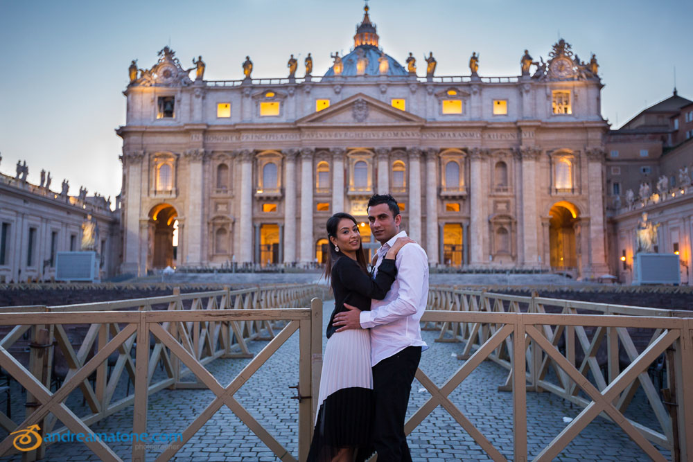 Portrait of a couple posing in front of Saint Peter's Basilica.