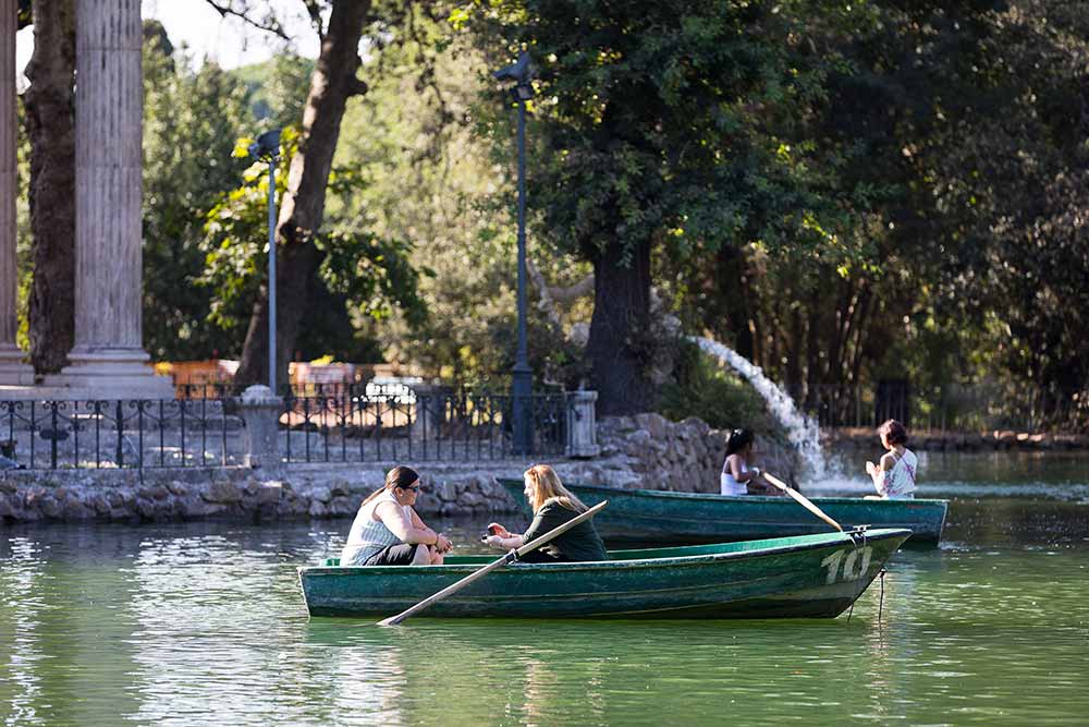 Asking the big question on a row boat on the Villa Borghese lake in Rome