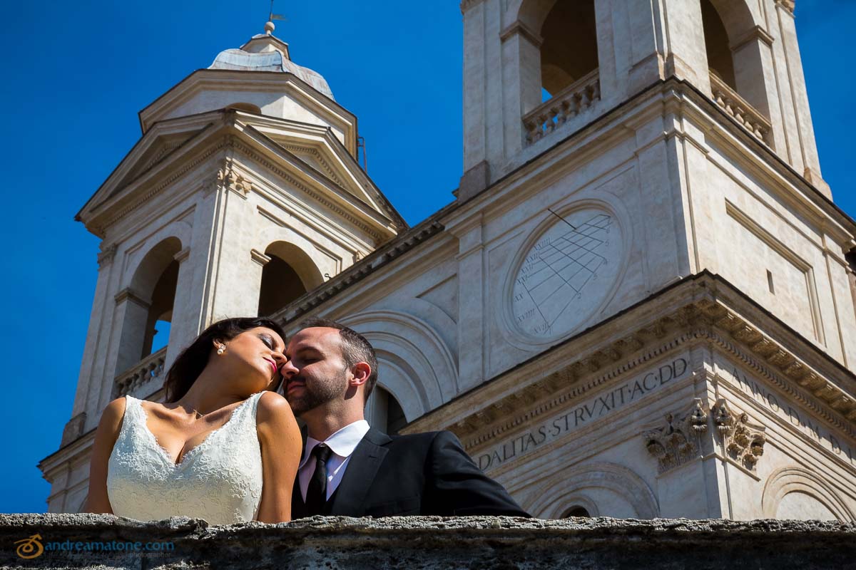 Close up picture of a wedding couple with blue sky above. 