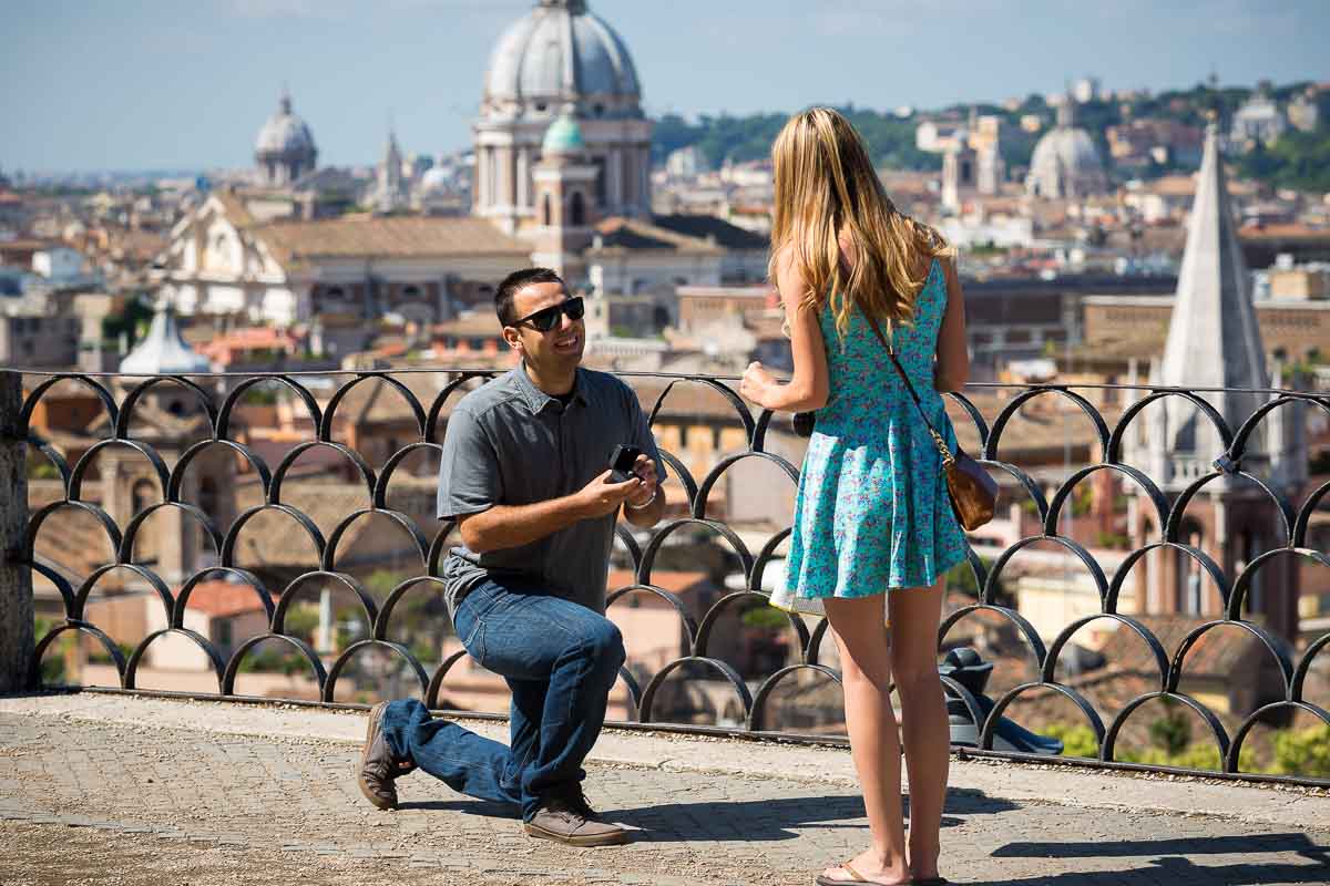 Knee down proposal photography Rome. Overlooking the roman rooftops.