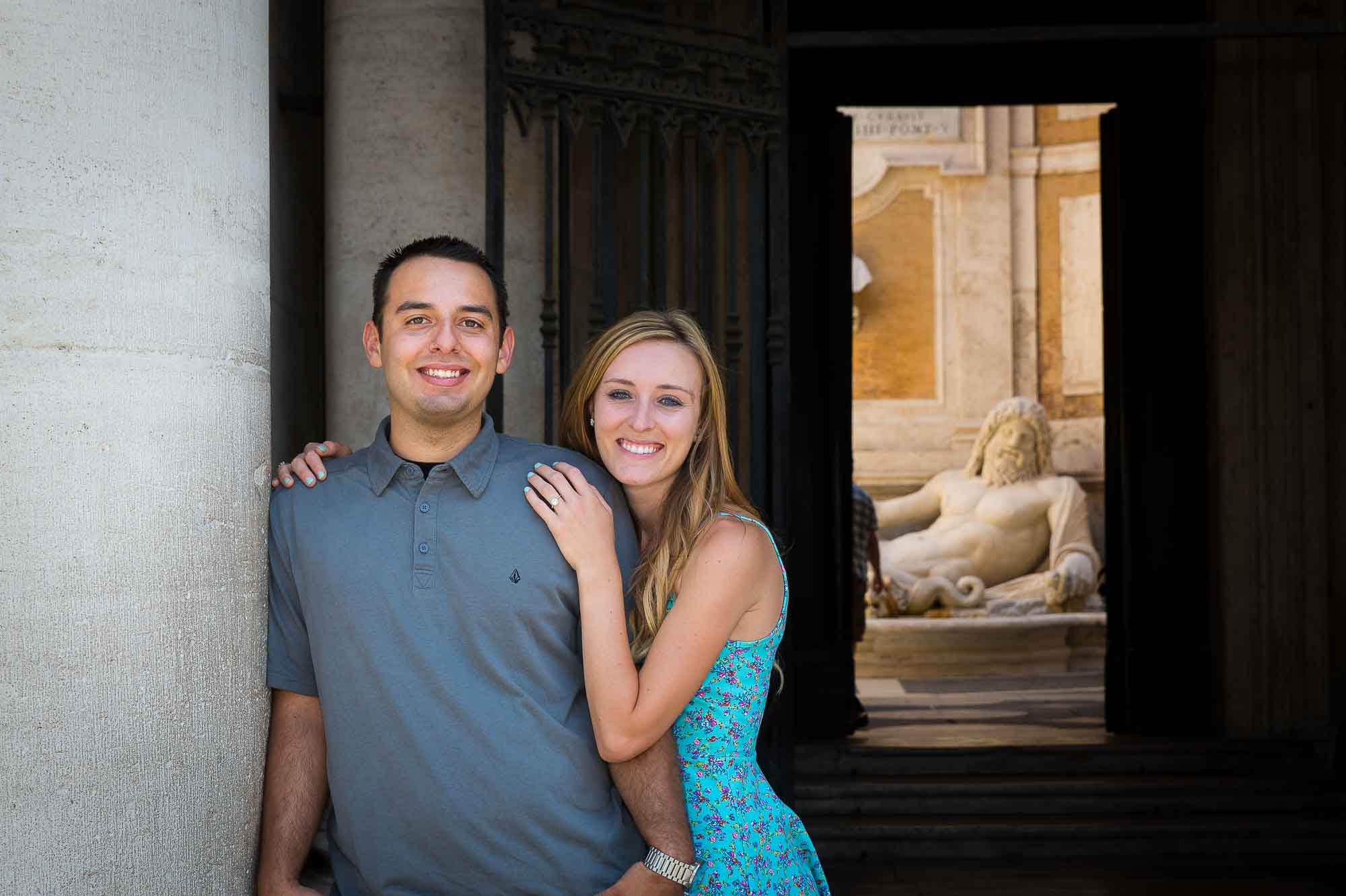 Posing for an engagement style portrait in Piazza del Campidoglio in Rome Italy
