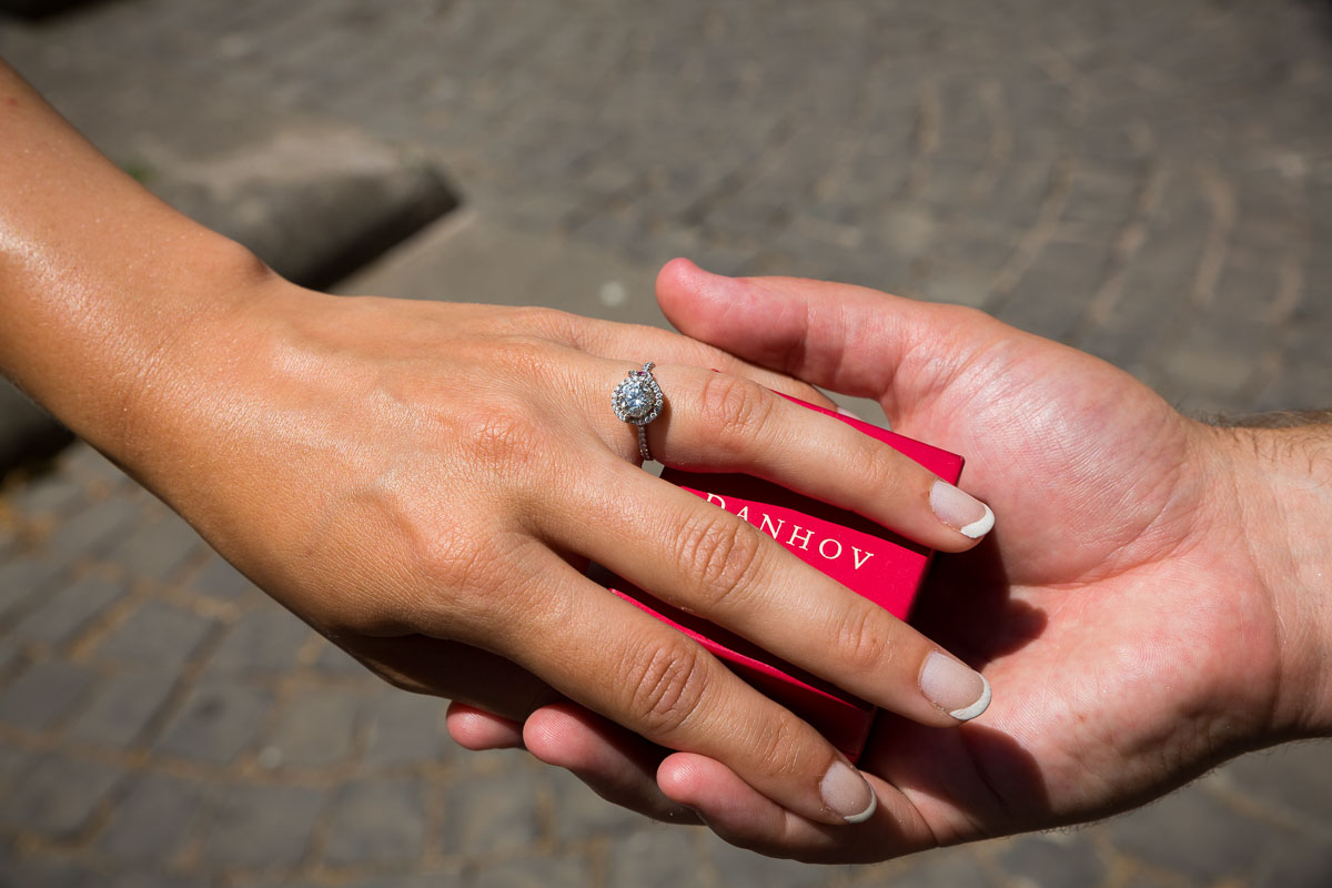 Couple holding a Danhov wedding ring.