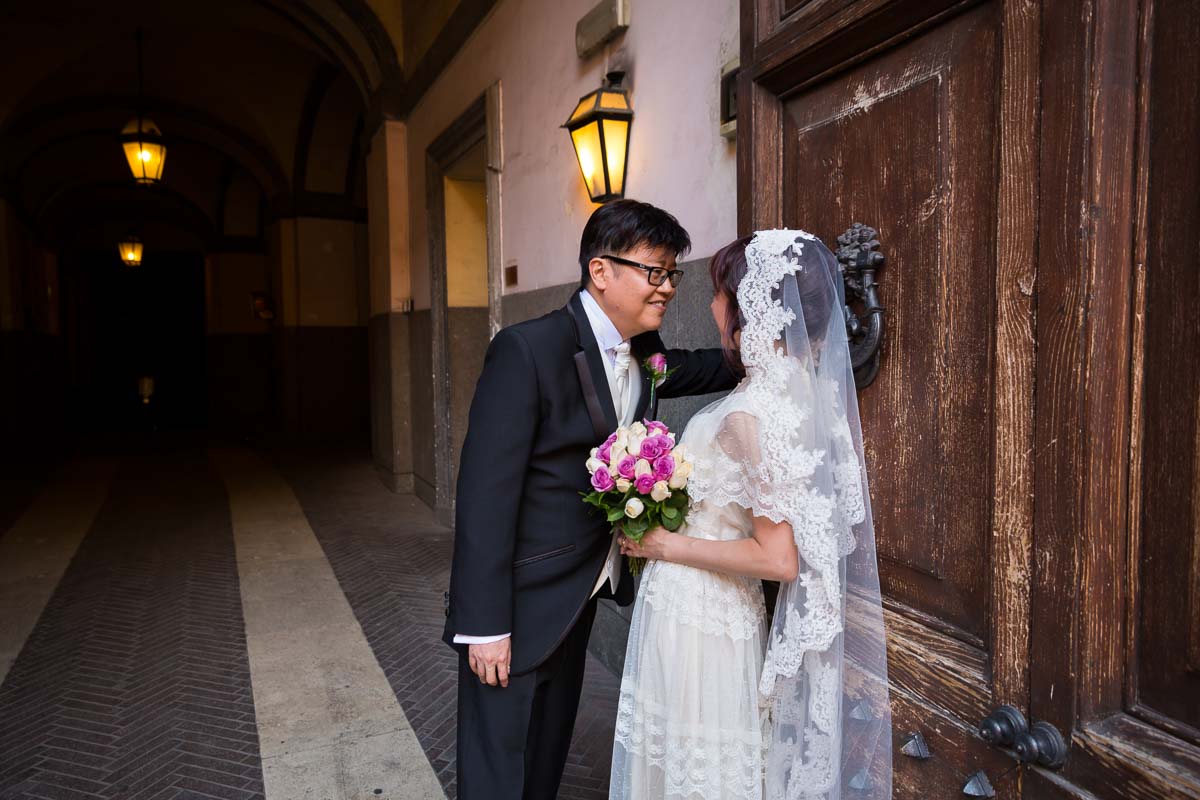 Wedding photo shoot in around the city by a characteristic wooden door