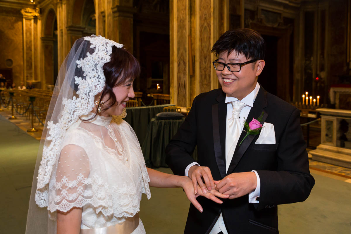 The wedding ring exchange during a Catholic matrimony