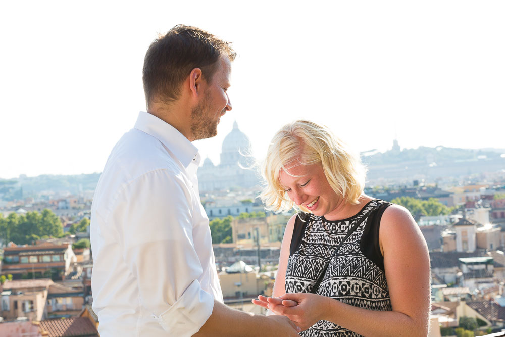 Looking at the engagement ring after the proposal in Rome