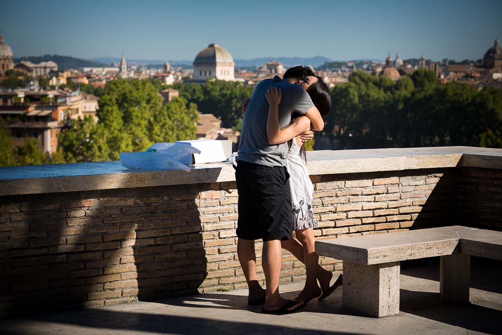 Couple hugging and embracing after a surprise proposal