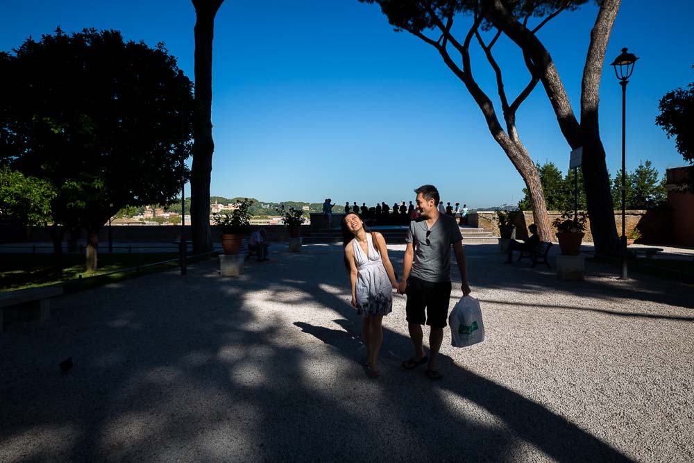 Walking away from Parco del Pincio together after a proposal