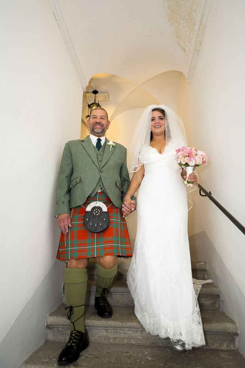 Father accompanying the bride to the altar.