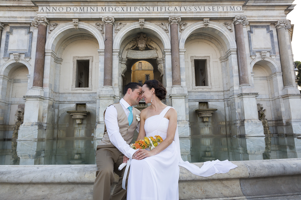 The gianicolo water fountain. Newlyweds posing for a picture.