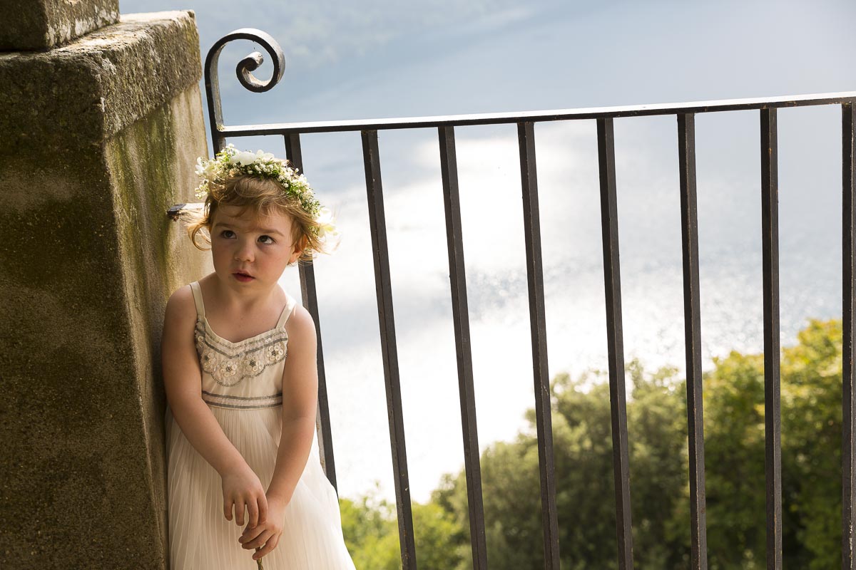 Flower girl portrait over the lake.