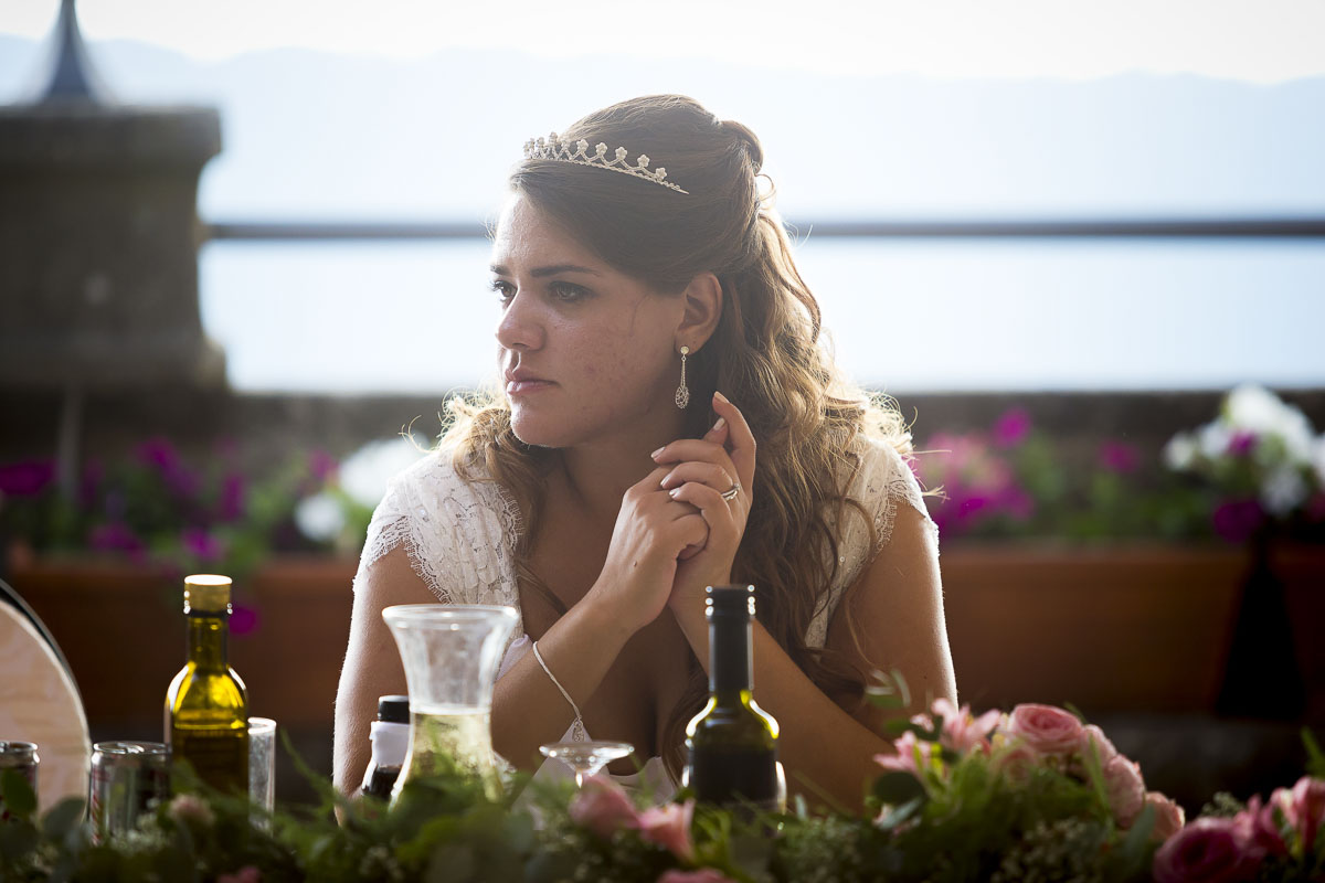 Portrait picture of the bride sitting at the table.