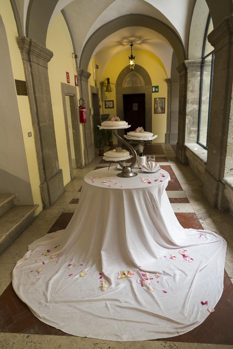 The wedding cake on the tables.