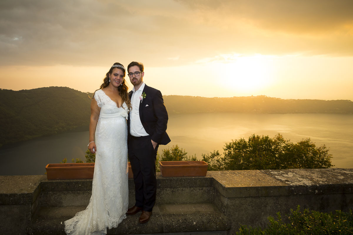 Bride and groom photographed over lake Castel Gandolfo.