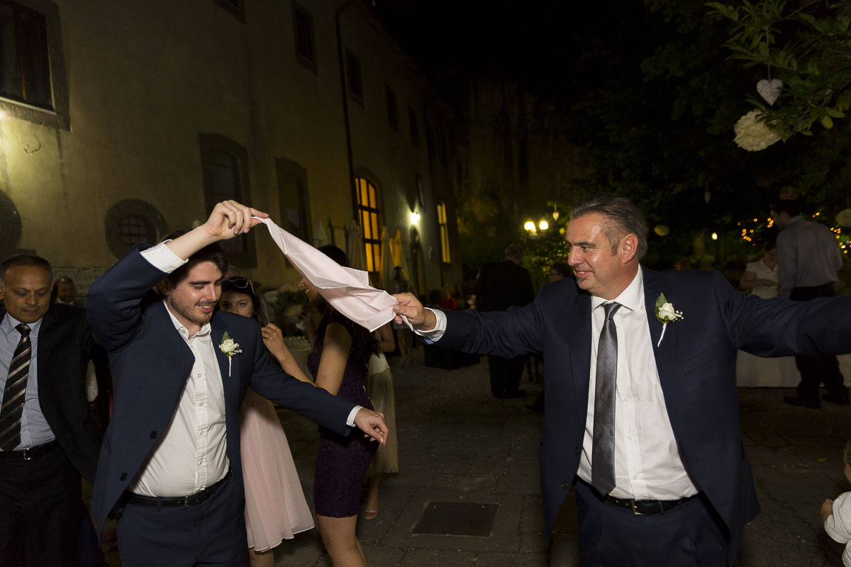 Dancing while holding a handkerchief . Greek wedding tradition.