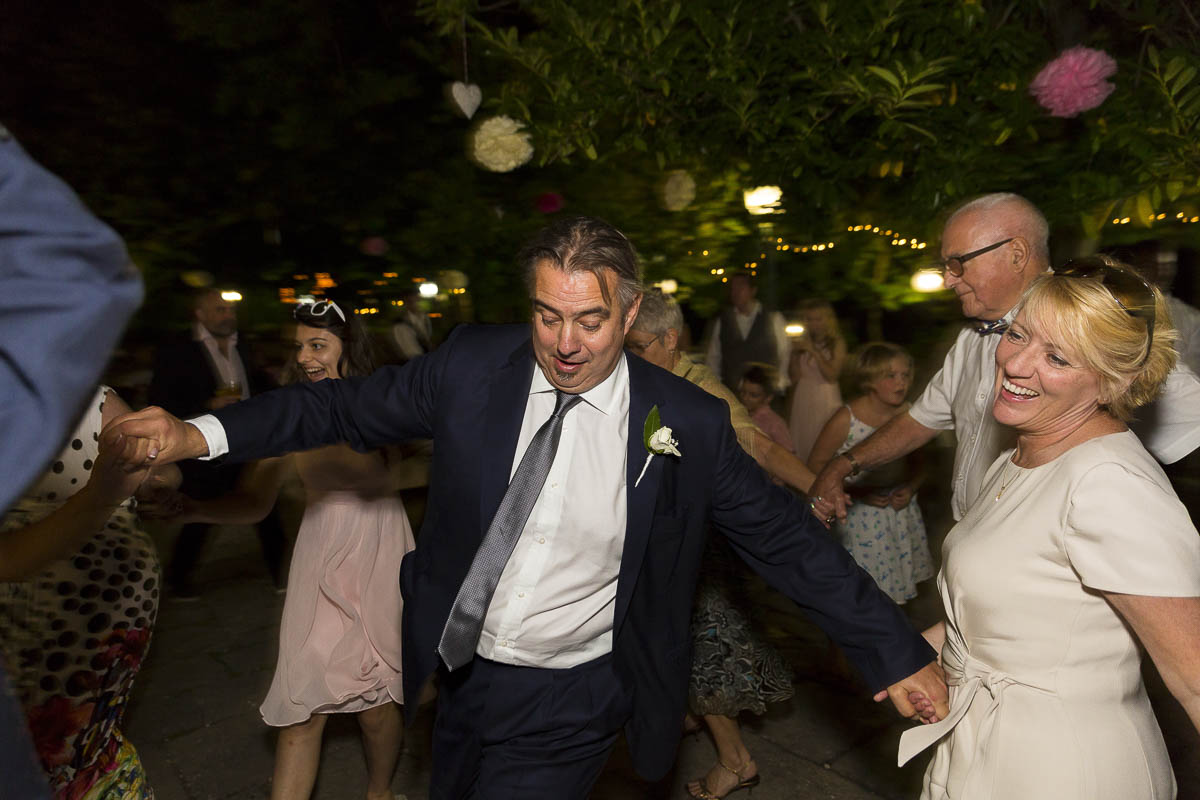 Greek wedding traditions. Dancing around the bride and groom.