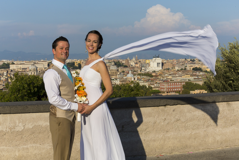 Bride and groom together after marriage. Photo of the wedding dress flying up in the air.