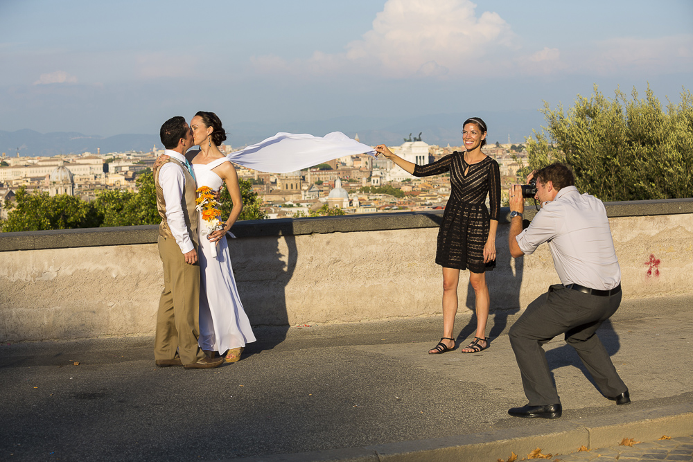 Picture of the photographer taking a photo at a wedding in Rome. 