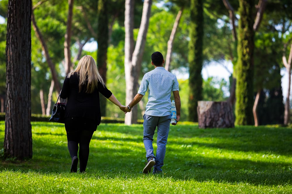 Walking together in a park hand in hand.