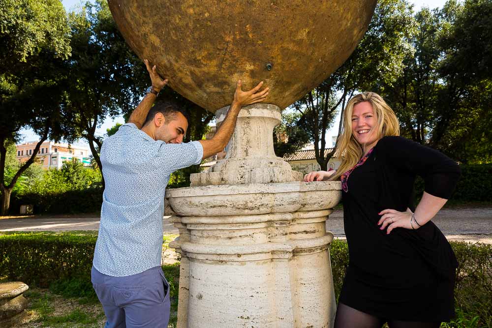 Holding a sculpture sphere during an e-session.