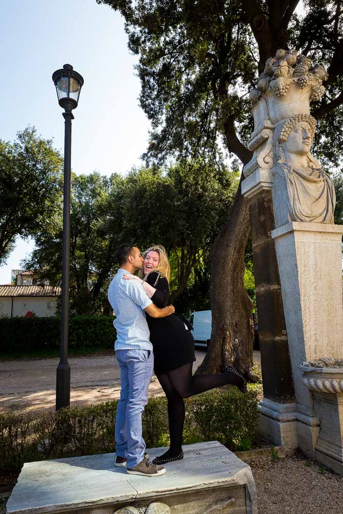 Kissing in a park.