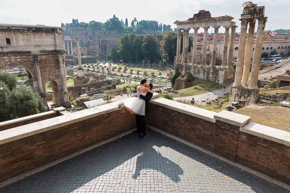 Wonderfully happy and in love during a photo shoot overlooking the ancient forum. Rome Honeymoon.