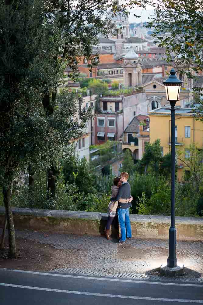 Couple close together during an engagement session in the roman streets. 