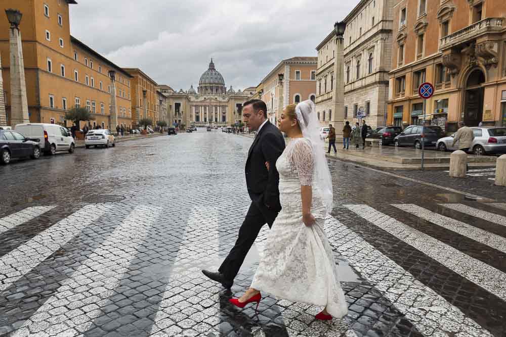 Crossing the streets with the St. Peter Cathedral dome in the background.