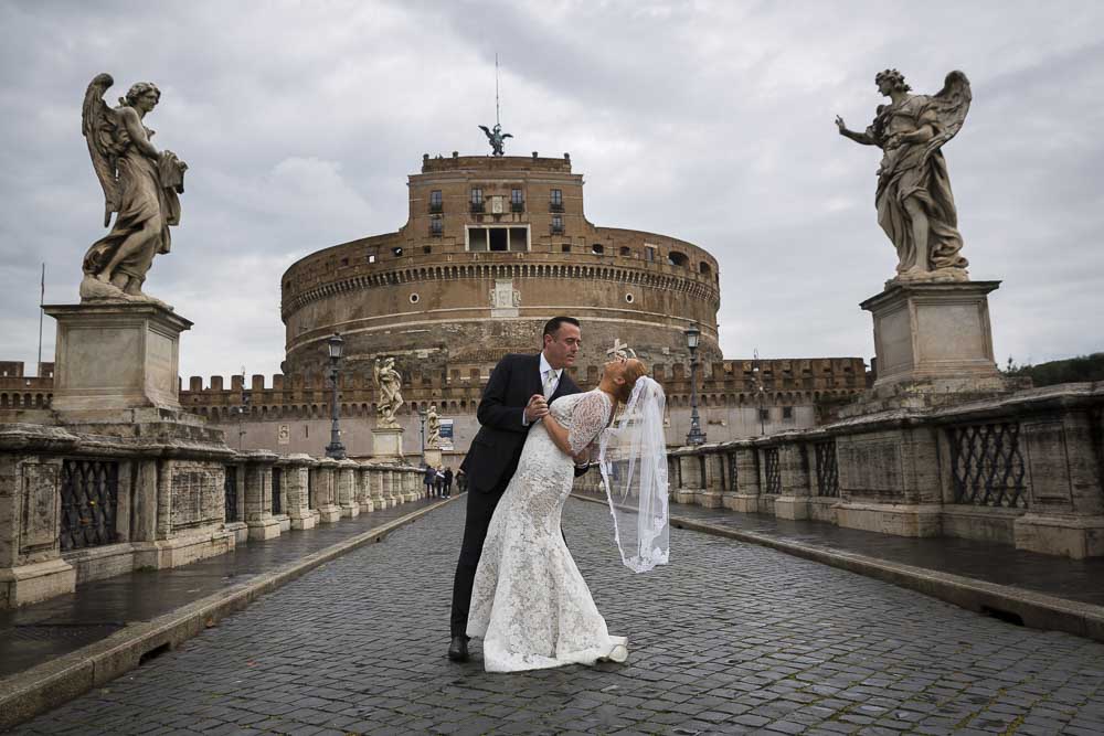 Dipping the bride on the Castel Sant'Angelo bridge.