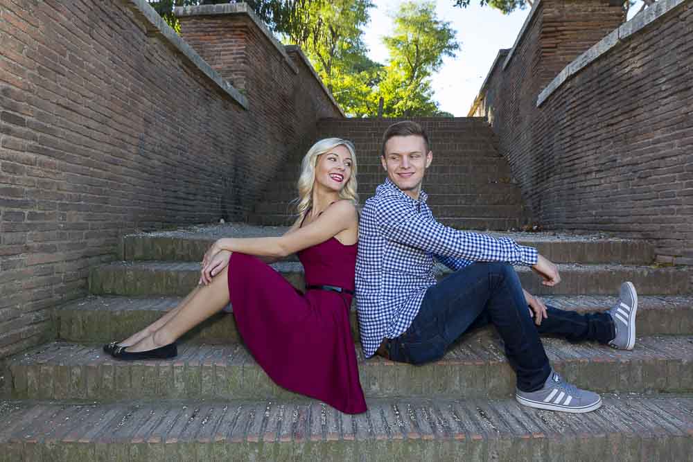 Sitting down on steps.