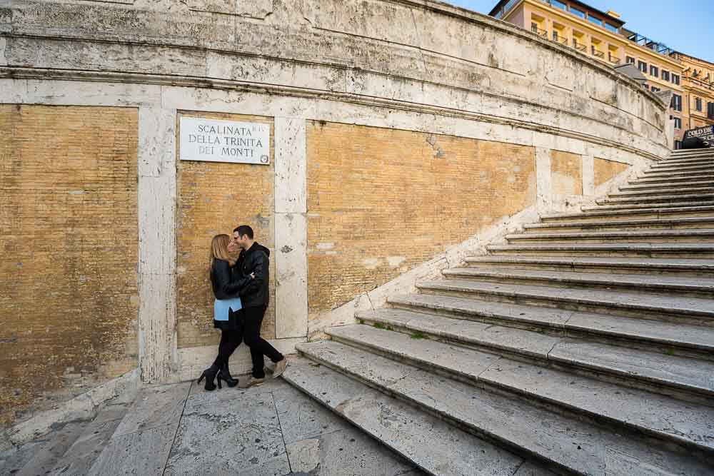 Picture taken of a couple posing on the Spanish steps in Rome