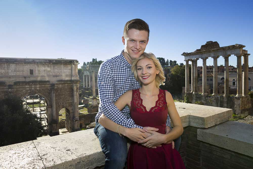 Sitting down pose shot in front of ancient ruins in Rome.