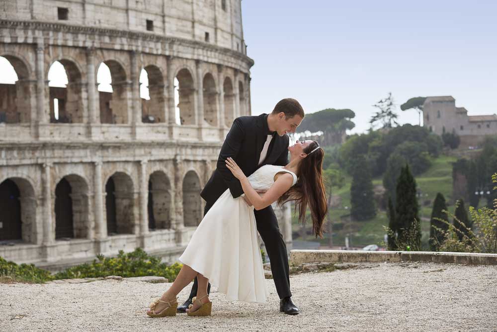 Dipping image taken at the Roman Colosseum with the beautiful monument in the background.