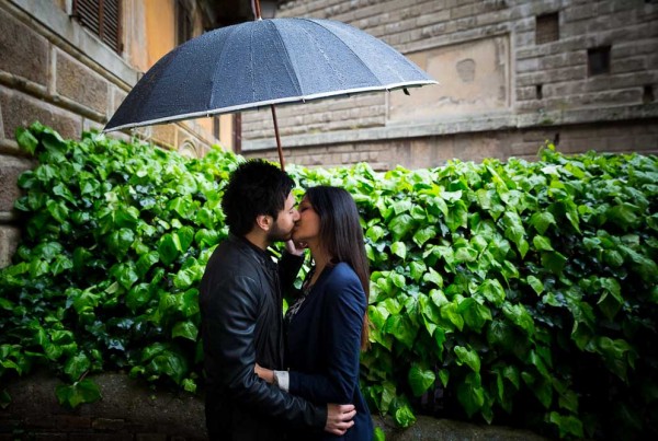 Engagement session in the rain under an umbrella