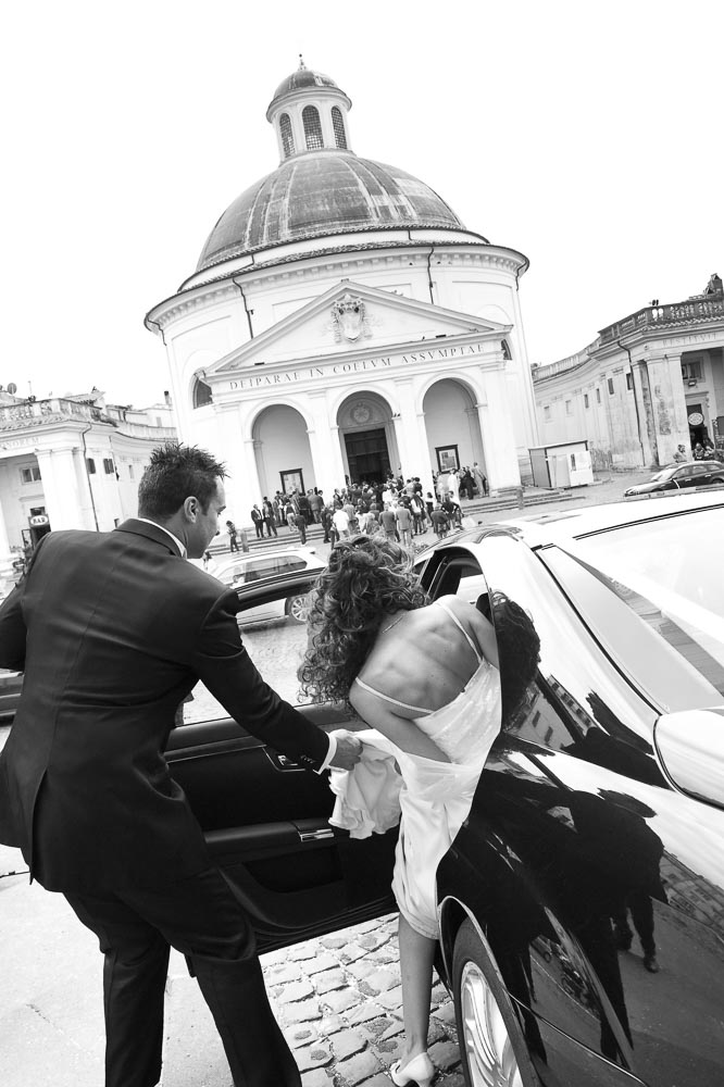 Wedding photography. Bride and groom. Black and white image. Ariccia Church. Italy.