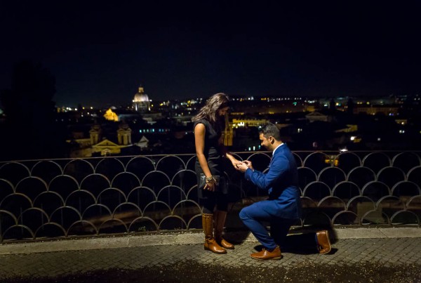 Nighttime wedding proposition taking place at Pincio terrace outlook