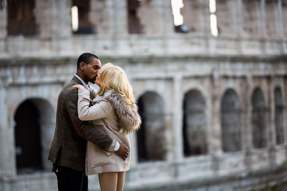 Kissing at the Coliseum. Romantic imagery from unique roman landmark
