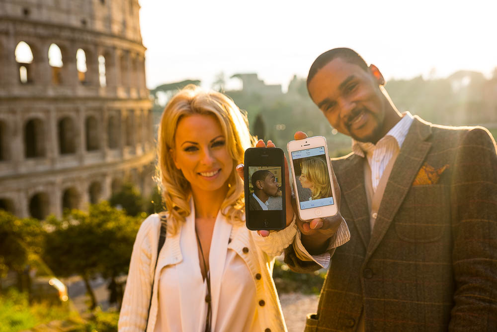 Mobile picture of a couple kissing through their screen image