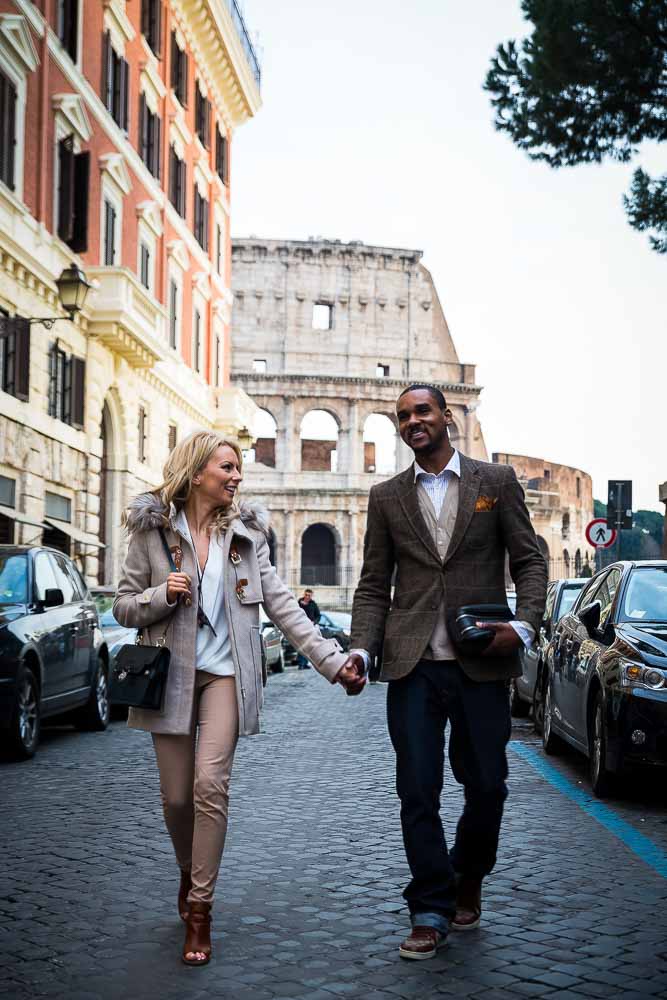 Walking around the city of Rome hand in hand with the Coliseum in background