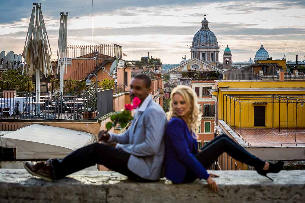 Sitting down by a wall overlooking the roman rooftops