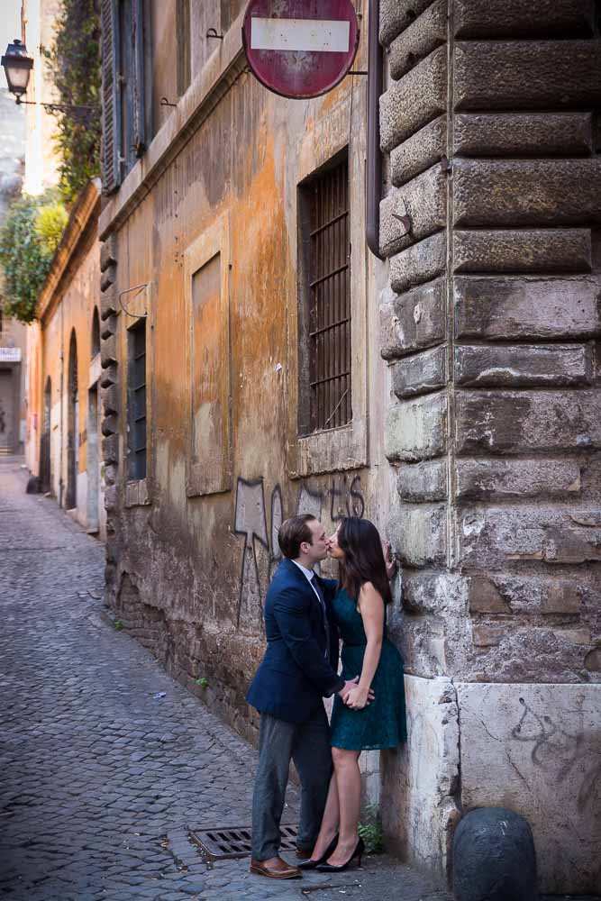 Kissing in an alley in the city of Rome