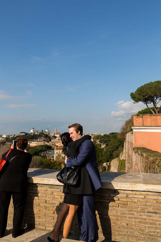 Couple embracing overlooking the city