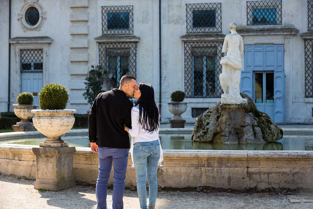 Couple kissing in a romantic location in Rome