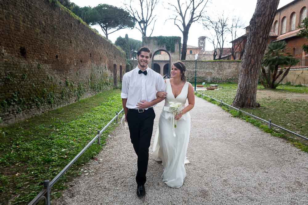 Bride and best man walking in the ceremony at Giardino degli Aranci
