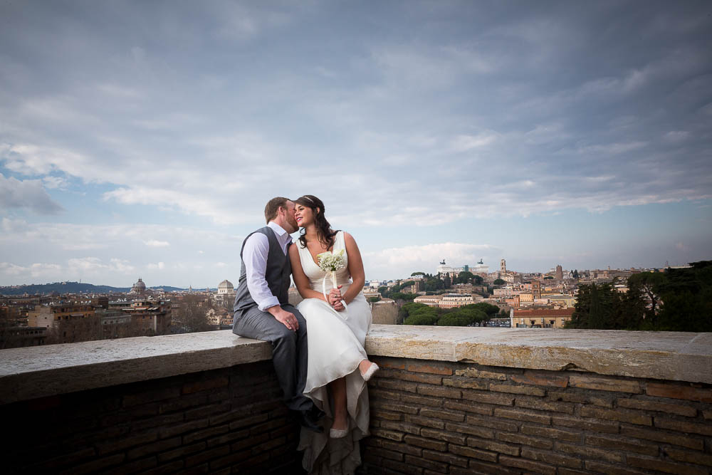 Bride and groom together under blue sky