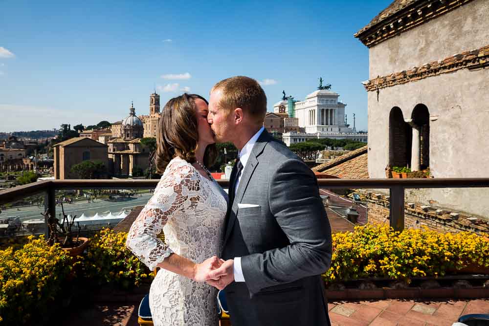 The groom may kiss the bride in Rome Italy.