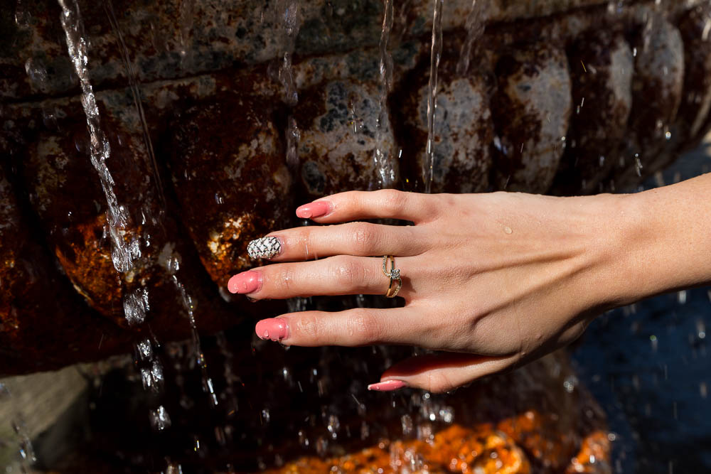 Close up photography of the engagement ring on her hand