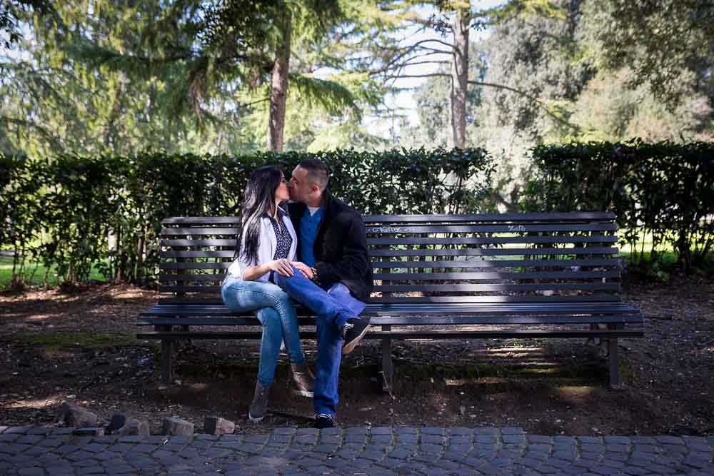 Sitting down on a park bench in a park