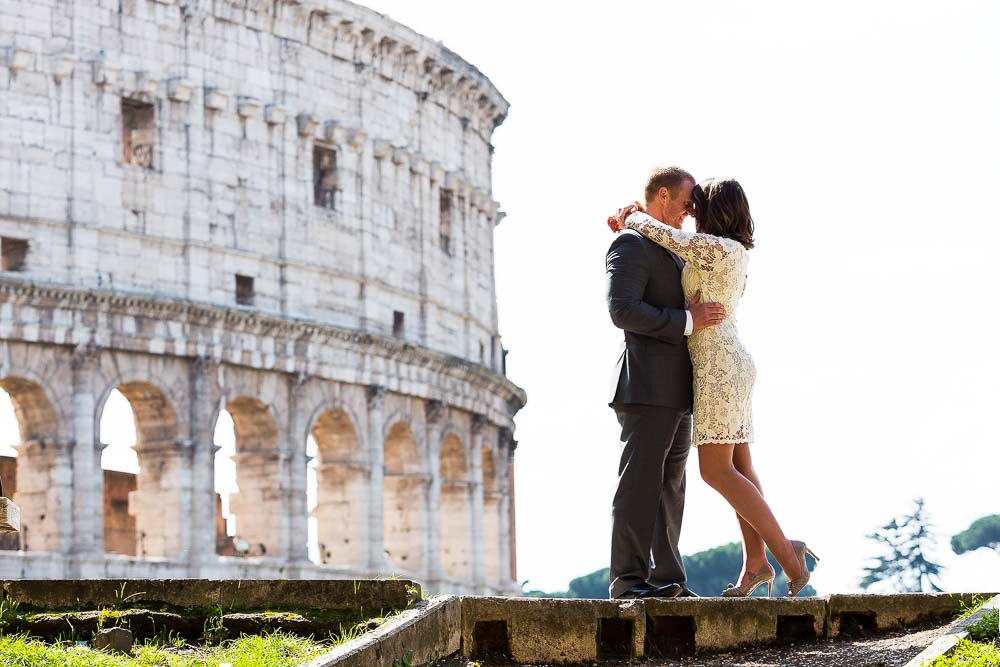 Bride and groom together at the Roman Colosseum posing for a photography session